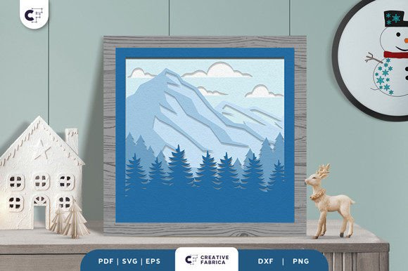 Evaluating the Snowy Peaks Shadow Box Paper Cut for Winter Home Decor